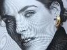 PNEUS Mini Half Hoops 3d printed Only for demonstration purposes. Earrings laying on a Paper Ad from Glamour Italia