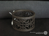 A large napkin ring with Mosaic-3a 3d printed The photo shows an own print (FDM print) made of black wood incl. decorative lacing.