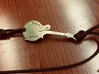 Mandolin Pendant 3d printed Pendant printed in Raw Brass on a bracelet. 