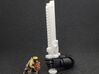 Action Figure Chainsword - Right Handed 3d printed Printed in White Natural Versatile Plastic, held by the hand of a 1:12 scale action figure arm, with a 28mm heroic scale model, Left Handed version shown