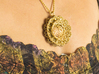 Geo Lotus (2014 version) 3d printed photo of pendant in natural brass on a model