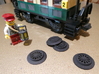 Brick RC Train Wheel Set, Spoked 3d printed Wagenmeister Karl inspects a delivery of spoked wheels waiting to be installed on an antique carriage.